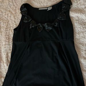 Cute black top with bows around collar